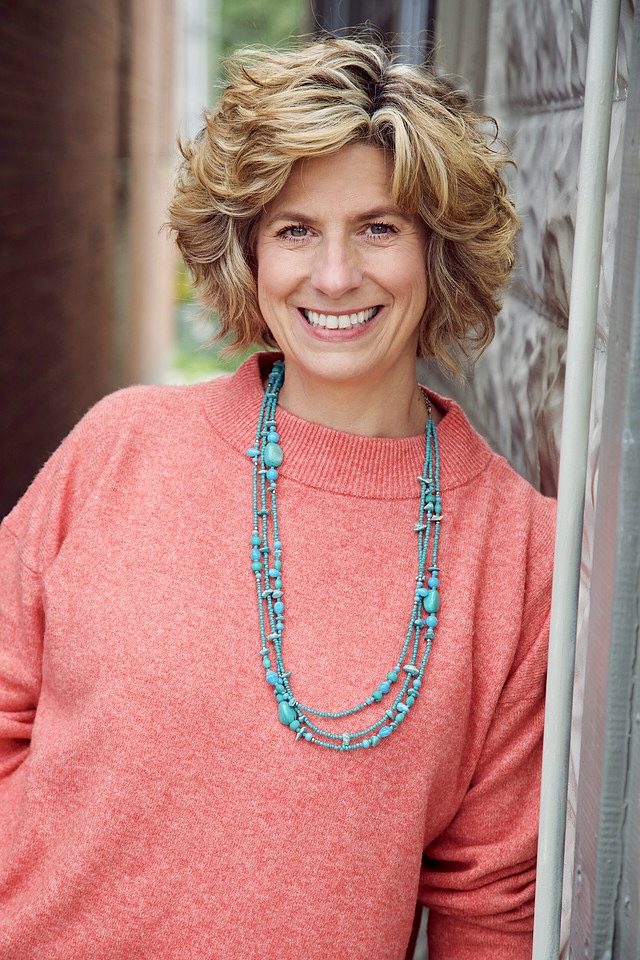 Kelly Kilmer in a coral sweater